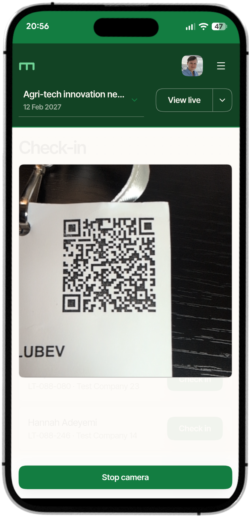 EventsBench check-in on a phone, scanning a delegate's badge QR code